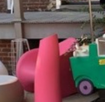 Pink chair with designer Table